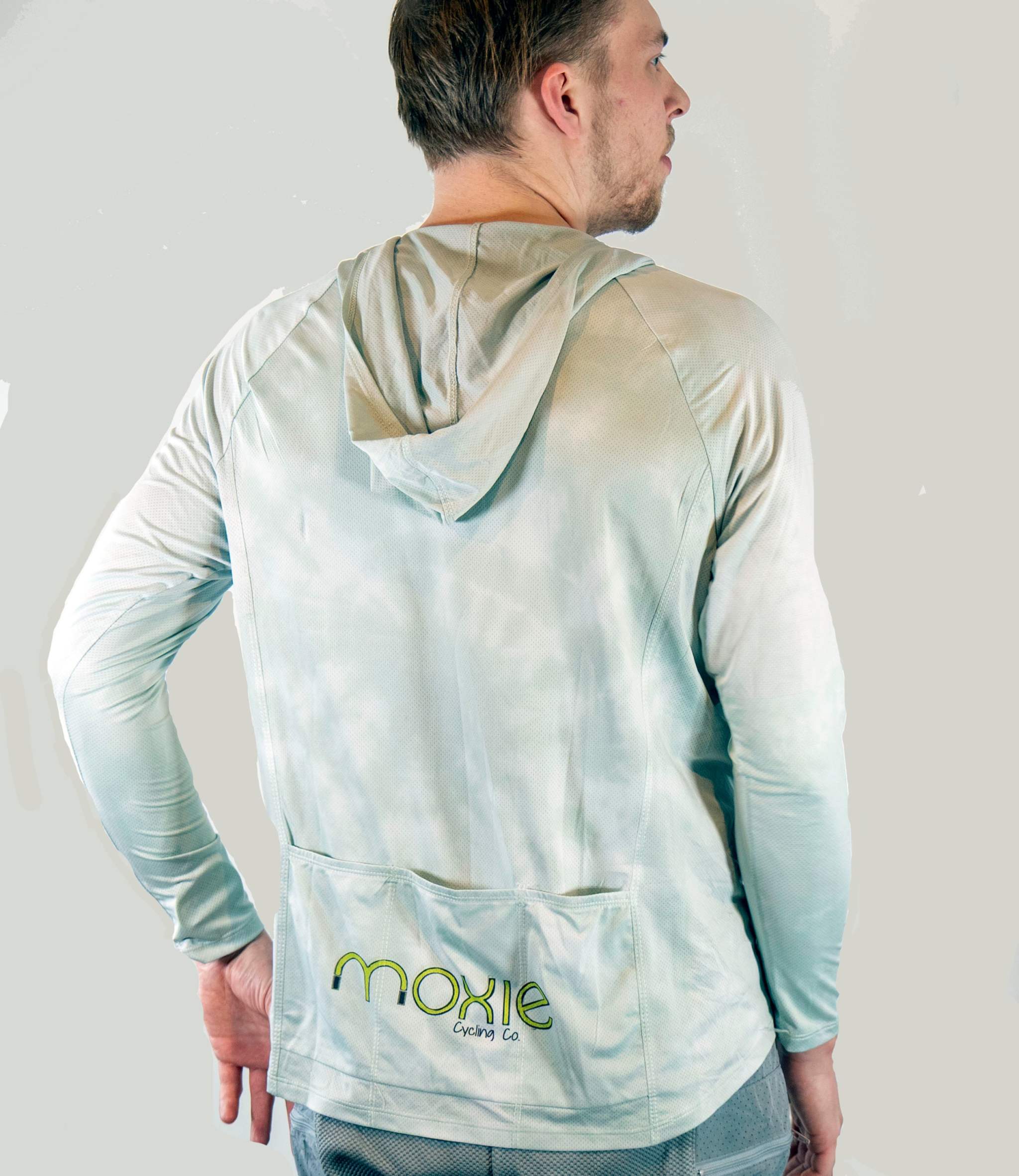 Person wearing a light-colored jacket with 'Moxie' branding on the back.