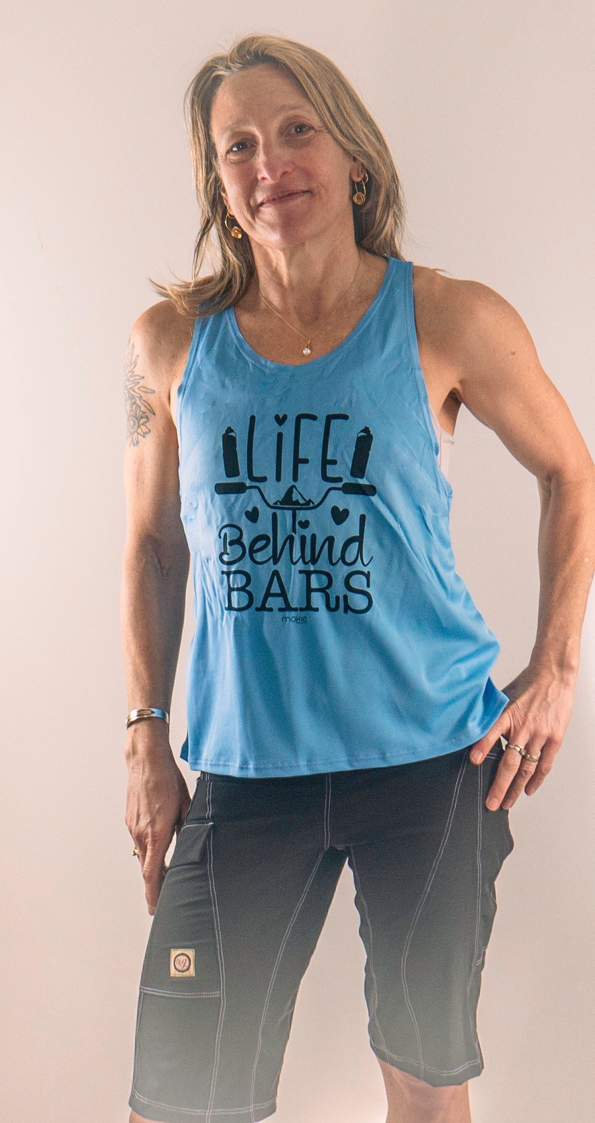 Life Behind Bars mountain bike tank top with light mesh fabric and drop back design.
