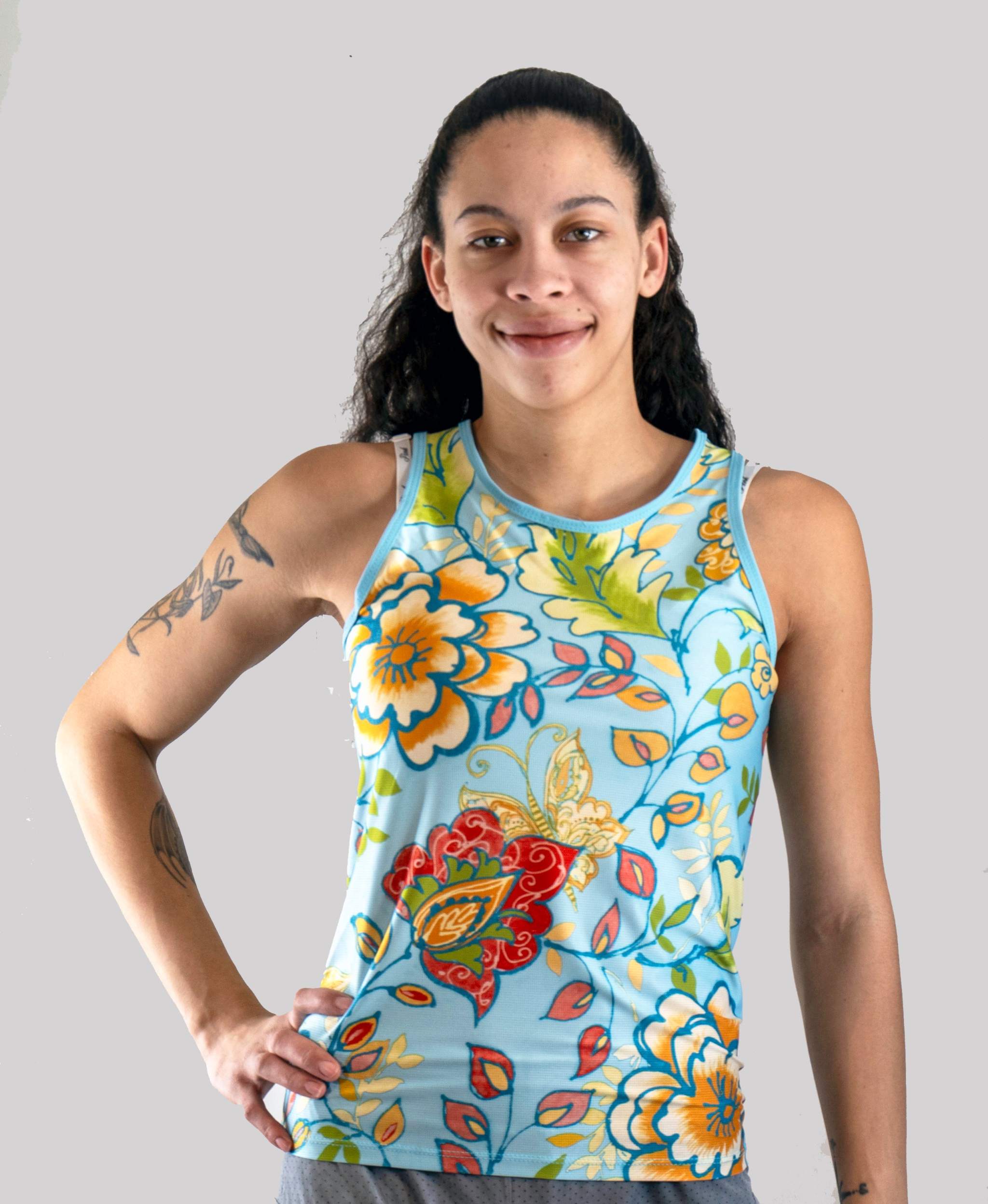 Women's sleeveless bike jersey with floral design, made of soft performance spandex, featuring back pockets for essentials