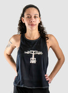 Woman wearing Moxie Tech Tank breathable mesh cycling jersey with "Ride Bikes Be Happy" graphic on summer ride
