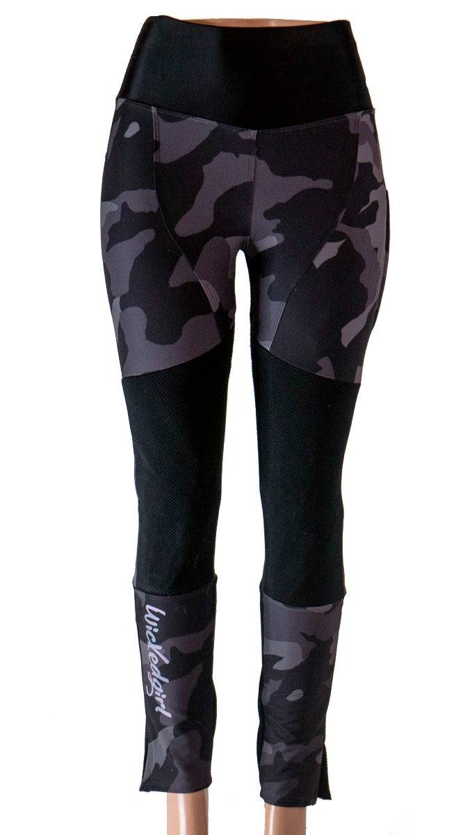 Mountain bike pants in black camo with reinforced knees and removable knee pads.