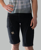 Women's Mountain Short - Jet Black with comfortable waistband and versatile pockets, featuring moisture-wicking fabric and purple top stitching.
