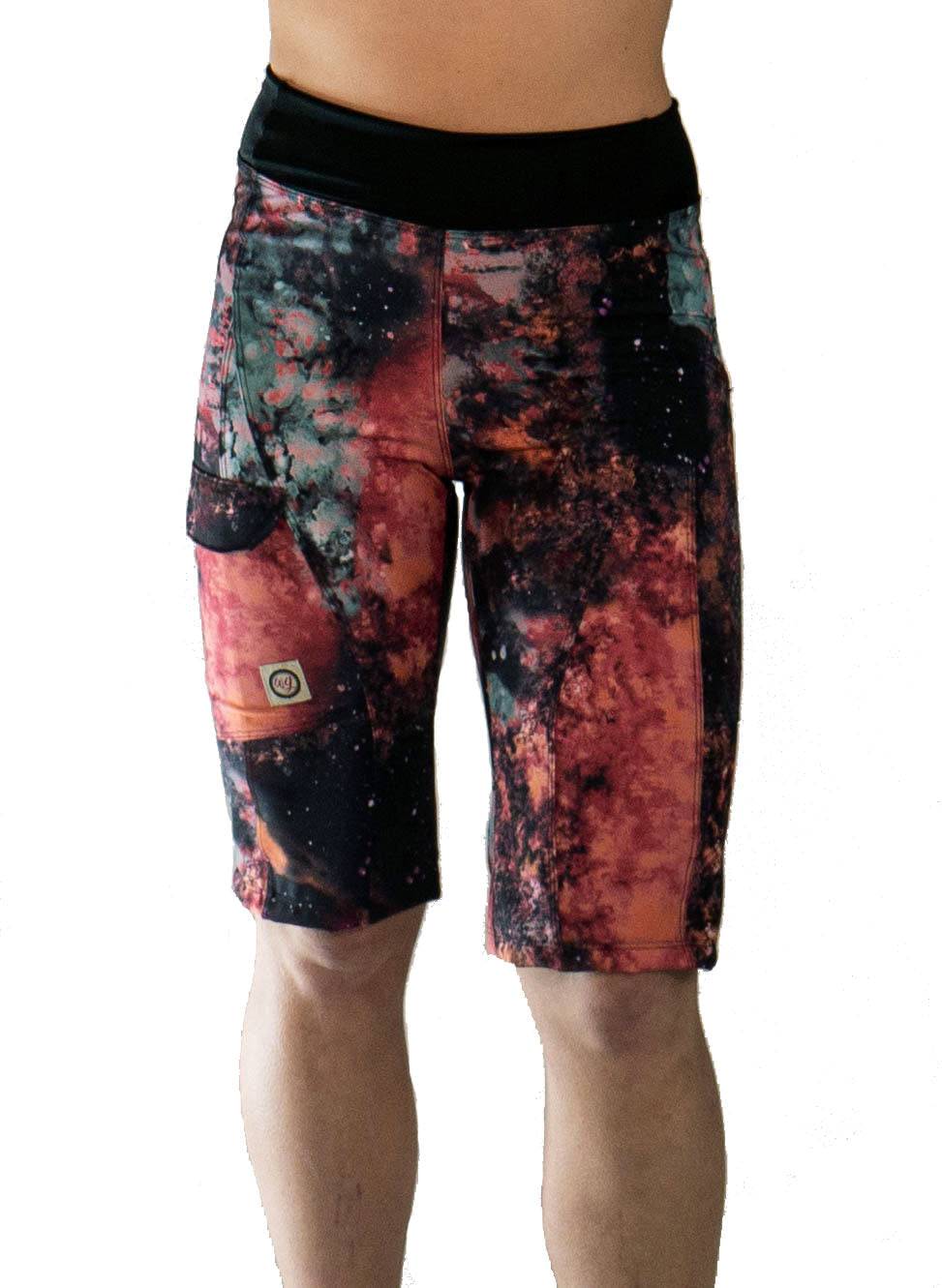 Women's mountain bike shorts in fiery colors with a comfortable elastic waistband, versatile pockets, and moisture-wicking fabric.