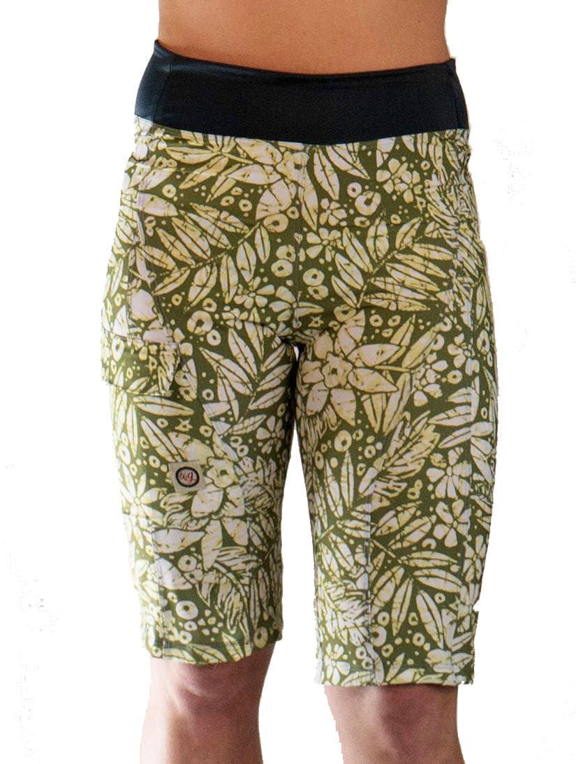Women's mountain bike shorts with leaf print, comfortable waistband, moisture-wicking fabric, and versatile pockets.