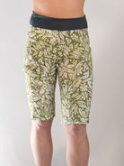 Woman wearing Mountain Short-Peace Leaf women's mountain bike shorts with green leafy pattern and black waistband.