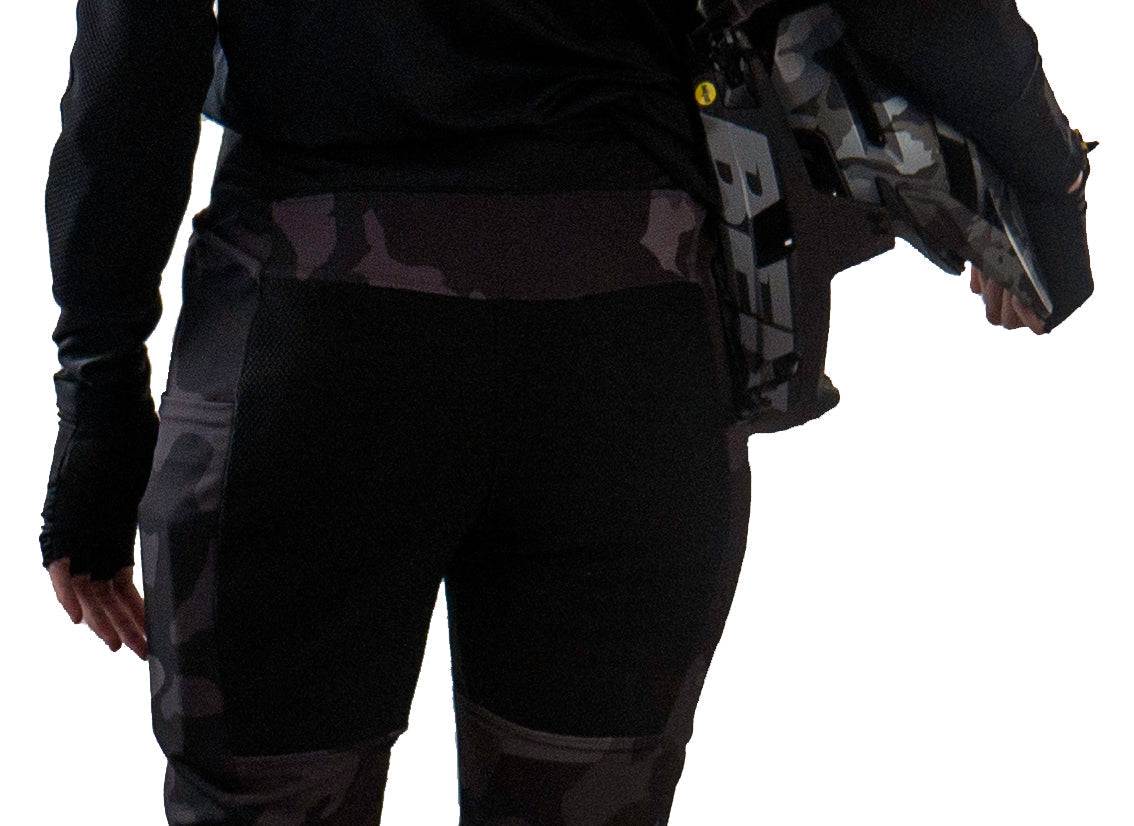 Women's technical mountain bike pants with integrated G-Form pads — back view