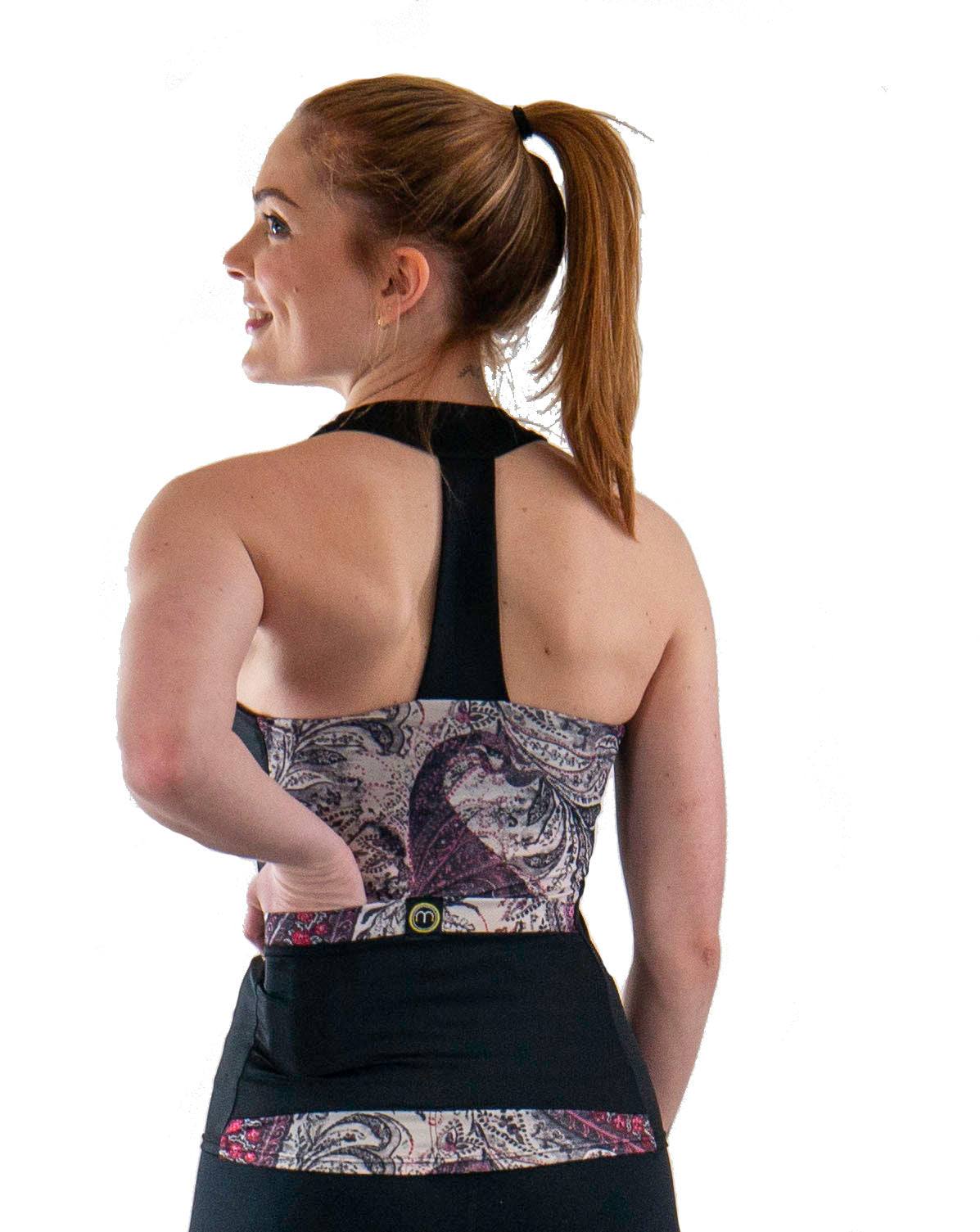 Paisley Greys T-back top with built-in bra and lightweight, moisture-wicking fabric.