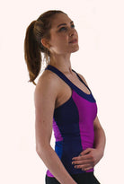 High Visibility Cycling Top in purple, featuring a T-back design and built-in bra for comfort and style.